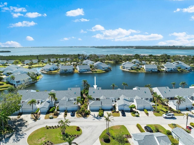 aerial view with a water view and a residential view
