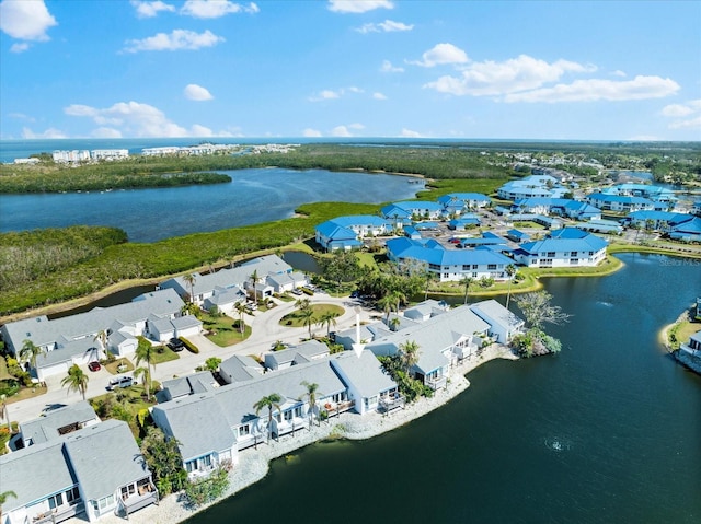 birds eye view of property featuring a water view and a residential view