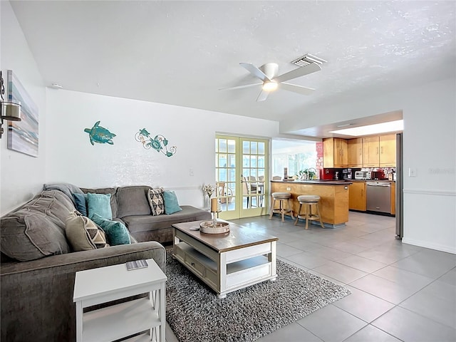 6012 11th Ave W, Bradenton, FL 34209 - living area with light tile patterned floors, visible vents, french doors, and ceiling fan