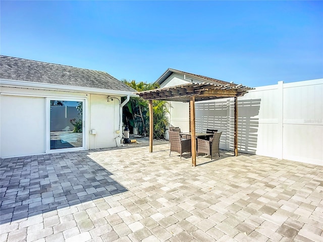 6012 11th Ave W, Bradenton, FL 34209 - view of patio featuring outdoor dining space, a pergola, and a fenced backyard