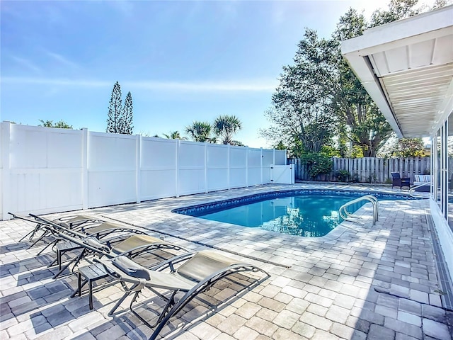 6012 11th Ave W, Bradenton, FL 34209 - view of swimming pool featuring a fenced backyard, a patio area, and a fenced in pool