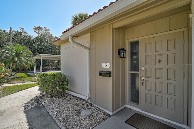 151 Vista Hermosa Cir Unit 31C, Sarasota, FL 34242 - view of exterior entry featuring a tile roof