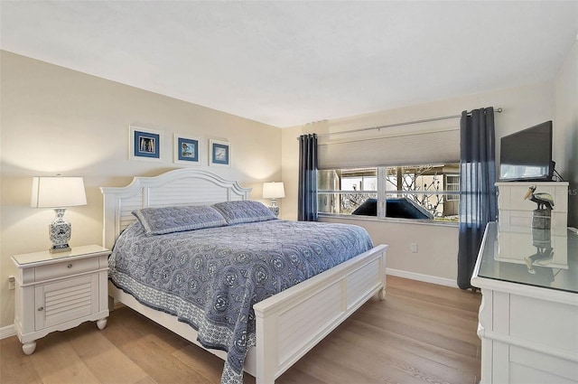 151 Vista Hermosa Cir Unit 31C, Sarasota, FL 34242 - bedroom with baseboards and wood finished floors