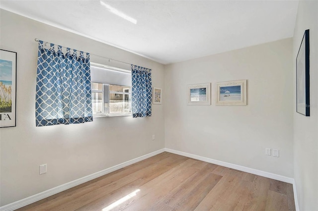 151 Vista Hermosa Cir Unit 31C, Sarasota, FL 34242 - unfurnished room with wood finished floors and baseboards