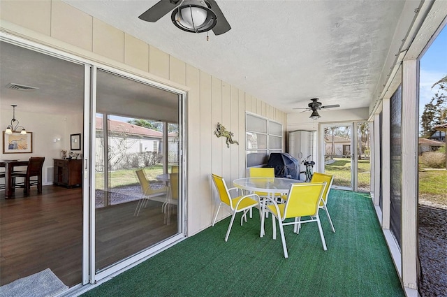 151 Vista Hermosa Cir Unit 31C, Sarasota, FL 34242 - sunroom / solarium featuring a ceiling fan and plenty of natural light