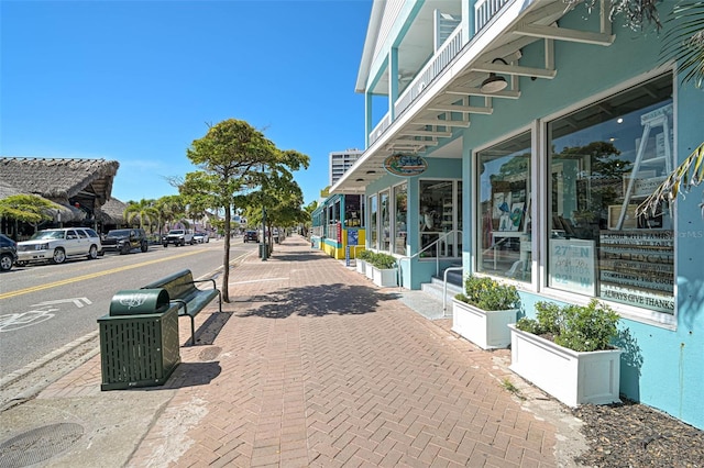 151 Vista Hermosa Cir Unit 31C, Sarasota, FL 34242 - view of asphalt street featuring sidewalks, curbs, and street lighting