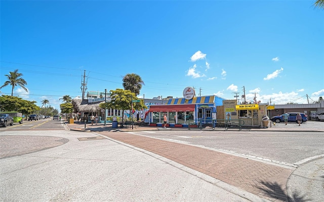 151 Vista Hermosa Cir Unit 31C, Sarasota, FL 34242 - view of asphalt street with curbs, sidewalks, and street lighting