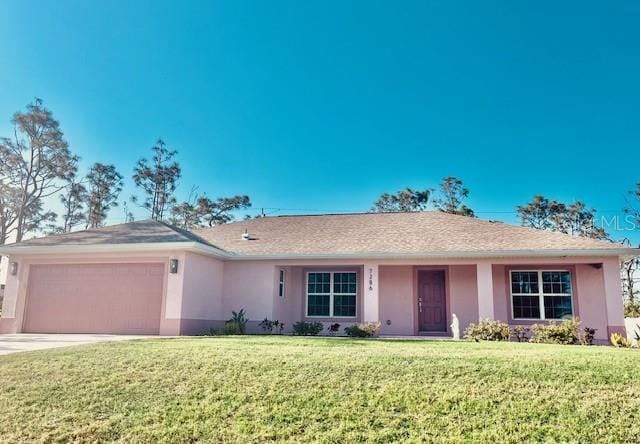 7286 Mineola Rd, Englewood, FL 34224 - ranch-style house with stucco siding, a garage, a front lawn, and driveway