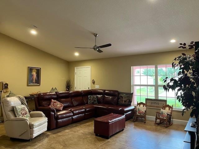7286 Mineola Rd, Englewood, FL 34224 - tiled living area featuring a ceiling fan, lofted ceiling, recessed lighting, and baseboards