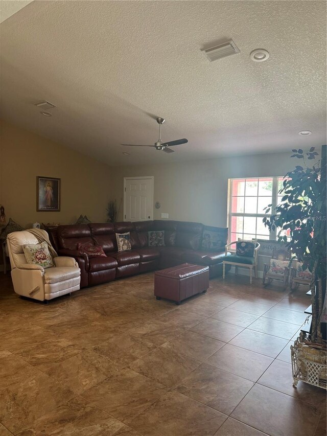 7286 Mineola Rd, Englewood, FL 34224 - living room featuring a textured ceiling and a ceiling fan