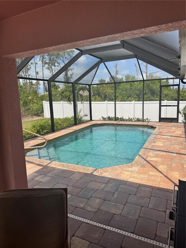 7286 Mineola Rd, Englewood, FL 34224 - view of swimming pool with a patio area, a fenced backyard, and glass enclosure