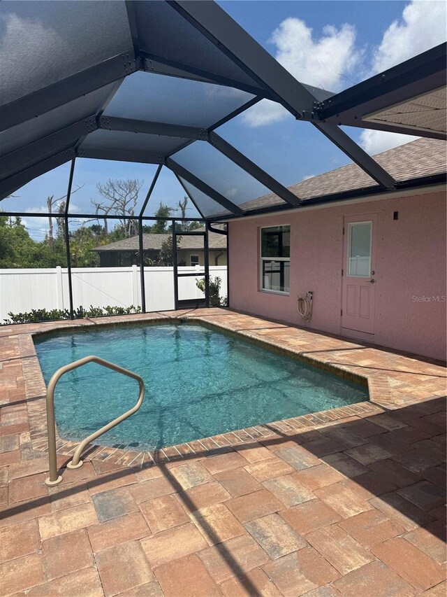 7286 Mineola Rd, Englewood, FL 34224 - view of pool with a patio area, fence, and a lanai