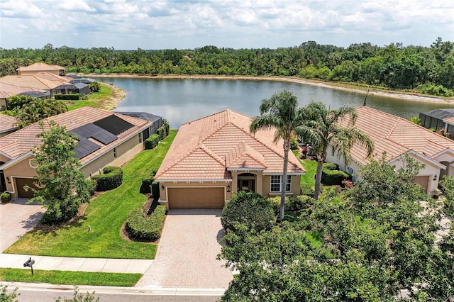 aerial view of property and surrounding area with a large body of water
