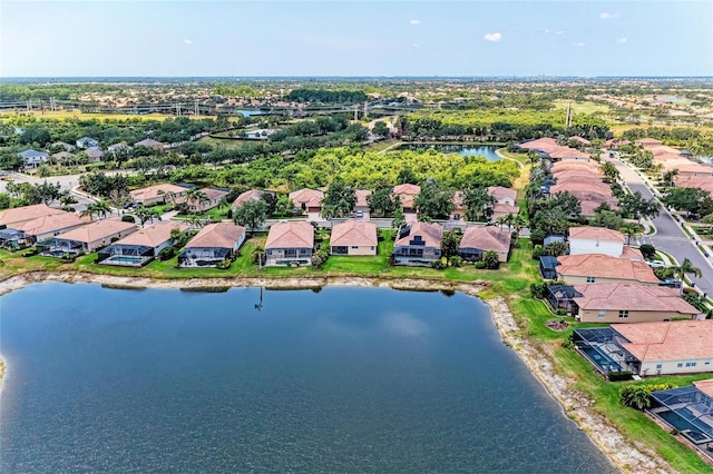 aerial view of residential area featuring a large body of water