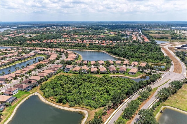 aerial view of residential area with a large body of water