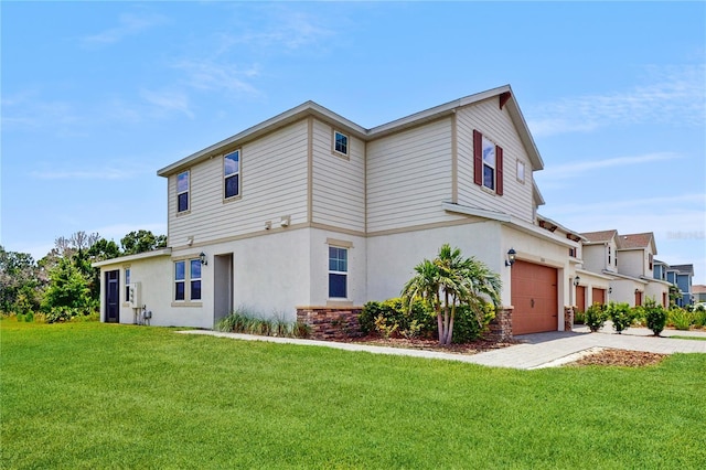 1824 Woodleaf Hammock Ct, Bradenton, FL 34211 - view of front of property featuring a garage, stucco siding, and a front yard