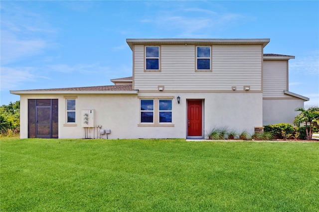 1824 Woodleaf Hammock Ct, Bradenton, FL 34211 - view of front facade featuring stucco siding, a front yard, and a shingled roof