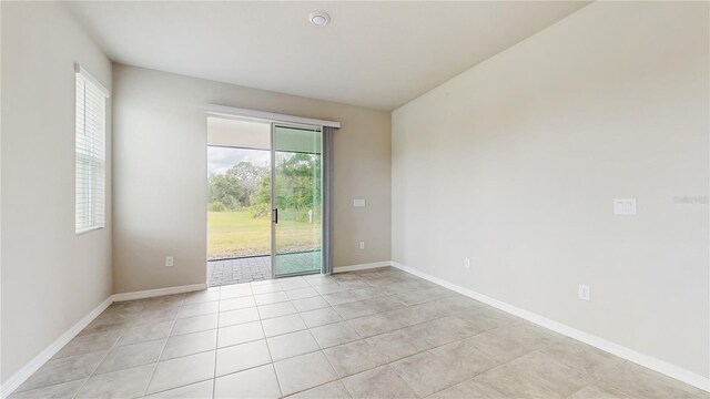 1824 Woodleaf Hammock Ct, Bradenton, FL 34211 - unfurnished room with light tile patterned floors and baseboards