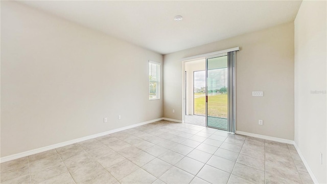 1824 Woodleaf Hammock Ct, Bradenton, FL 34211 - empty room with light tile patterned floors and baseboards