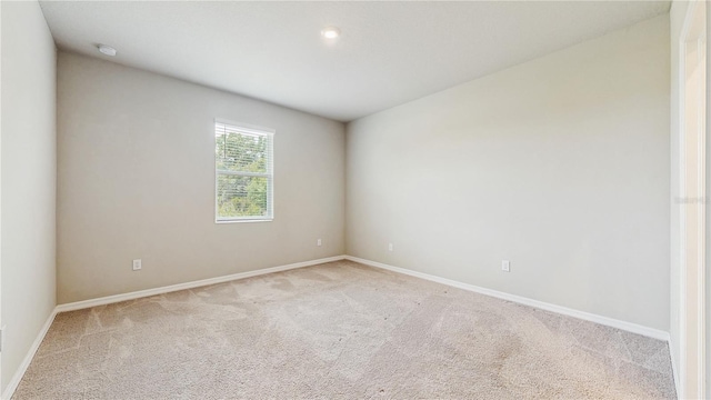 1824 Woodleaf Hammock Ct, Bradenton, FL 34211 - unfurnished room featuring light colored carpet, baseboards, and a smoke detector