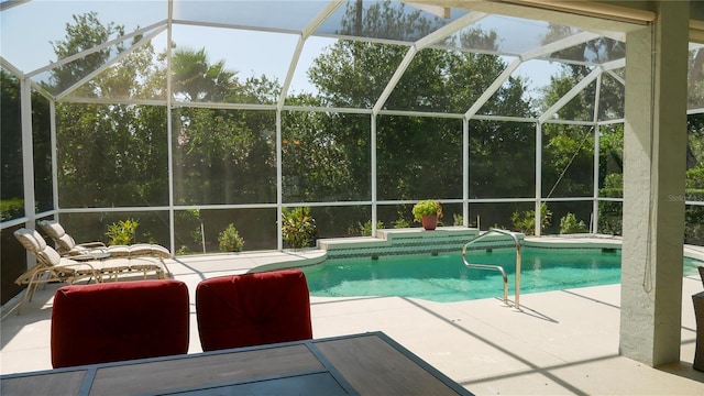 swimming pool with a patio and a lanai