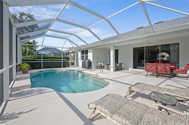 7424 Arrowhead Run, Lakewood Ranch, FL 34202 - swimming pool featuring ceiling fan, a patio area, and glass enclosure