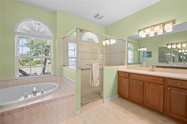 7424 Arrowhead Run, Lakewood Ranch, FL 34202 - bathroom featuring a bath, tile patterned flooring, a stall shower, and vanity