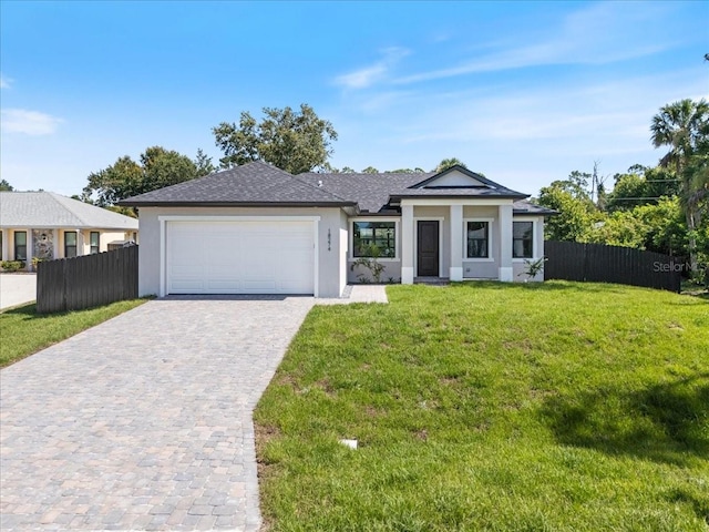 18274 Grace Ave, Port Charlotte, FL 33948 - view of front facade featuring stucco siding, decorative driveway, an attached garage, and roof with shingles