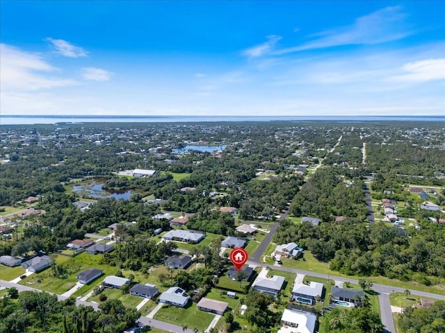 18274 Grace Ave, Port Charlotte, FL 33948 - aerial view of property and surrounding area with a large body of water and nearby suburban area