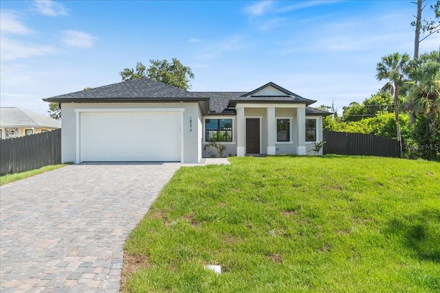 18274 Grace Ave, Port Charlotte, FL 33948 - view of front of home with decorative driveway, stucco siding, an attached garage, and roof with shingles