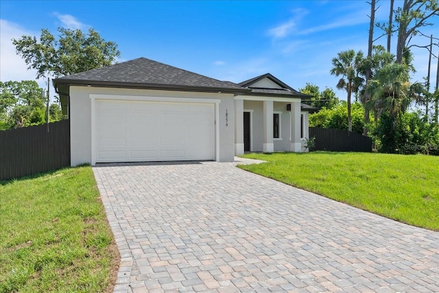 18274 Grace Ave, Port Charlotte, FL 33948 - view of front of property with stucco siding, decorative driveway, and an attached garage