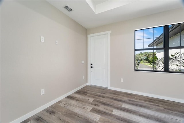 18274 Grace Ave, Port Charlotte, FL 33948 - unfurnished room with wood finished floors and baseboards