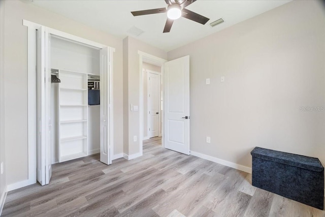 18274 Grace Ave, Port Charlotte, FL 33948 - unfurnished bedroom featuring wood finished floors, ceiling fan, and a closet