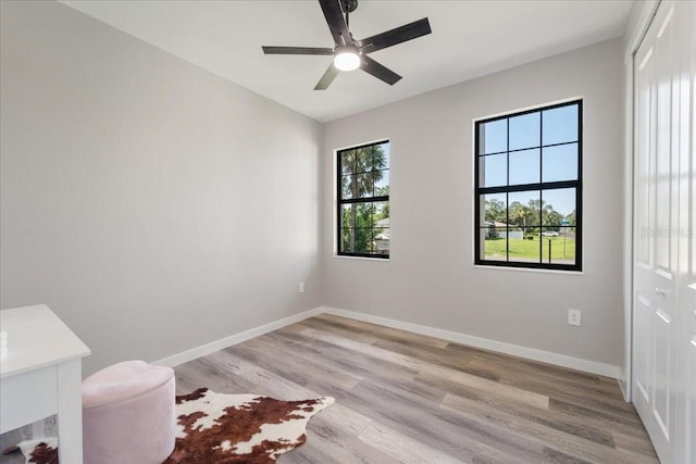18274 Grace Ave, Port Charlotte, FL 33948 - unfurnished bedroom featuring light wood-style flooring, a closet, and a ceiling fan