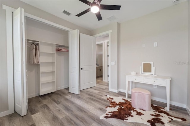 18274 Grace Ave, Port Charlotte, FL 33948 - bedroom featuring light wood-style flooring, ceiling fan, and a closet