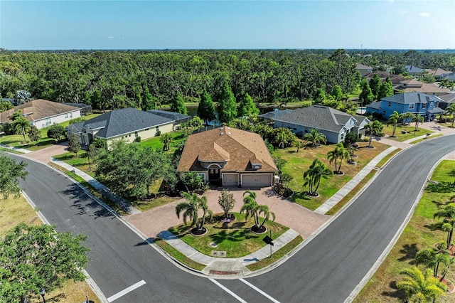 aerial perspective of suburban area featuring a forest