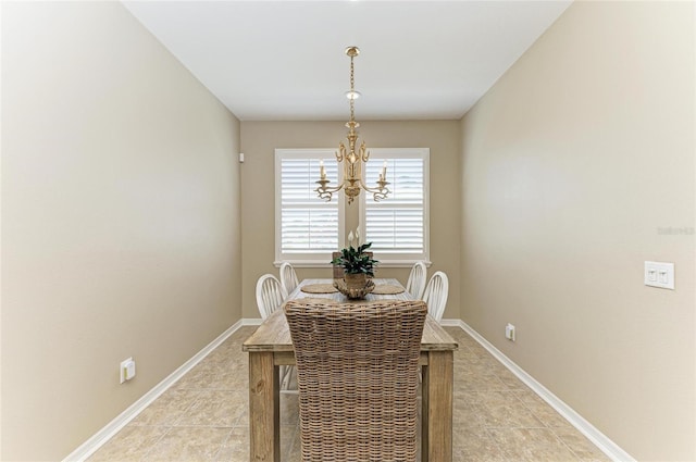 dining room featuring a chandelier, light tile patterned flooring, and baseboards