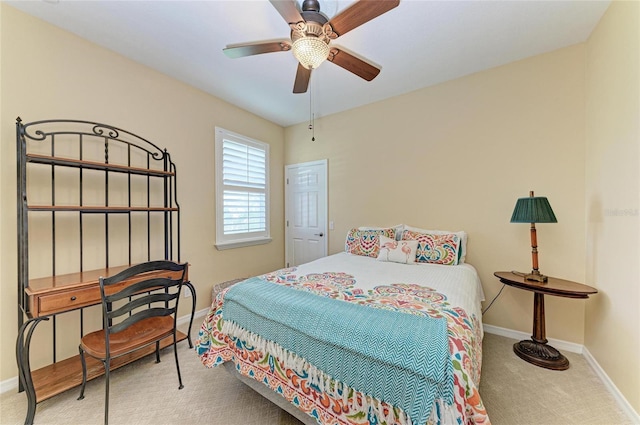 carpeted bedroom with baseboards and ceiling fan
