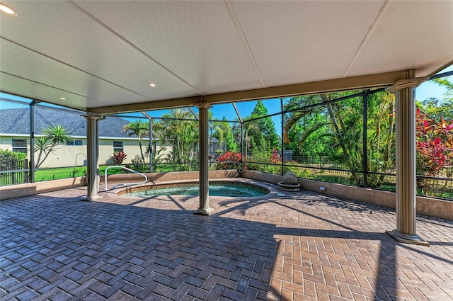 view of swimming pool featuring an in-ground hot tub, a patio, and glass enclosure