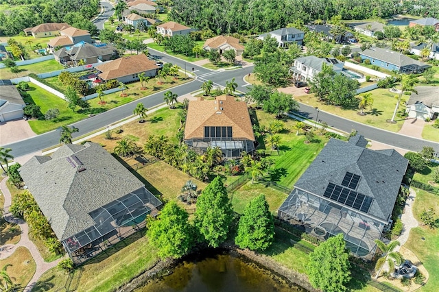 aerial view of property and surrounding area featuring nearby suburban area