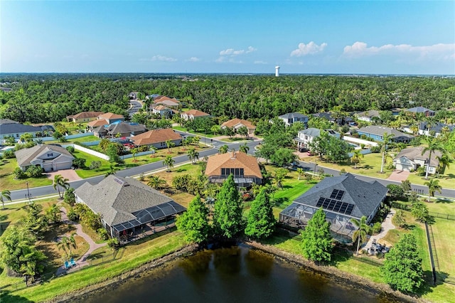 aerial view of residential area featuring a large body of water