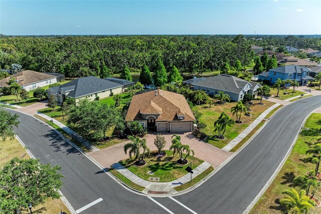 5439 74th Pl E, Ellenton, FL 34222 - aerial perspective of suburban area with a heavily wooded area
