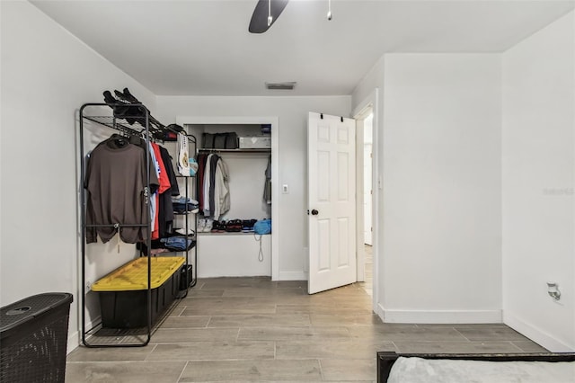 mudroom featuring visible vents, baseboards, and wood tiled floor