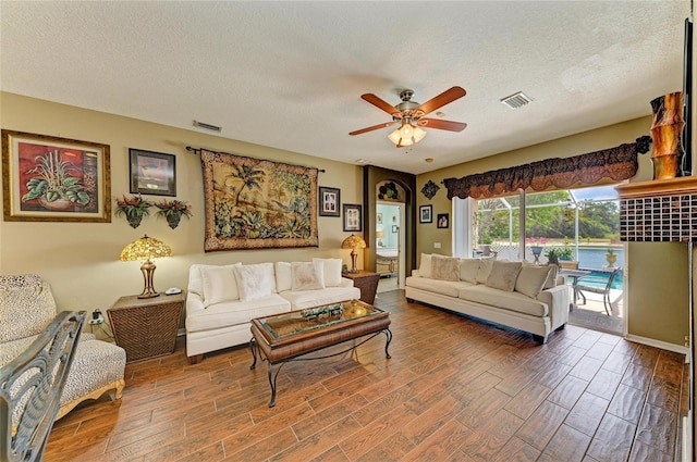4211 30th Ln E, Bradenton, FL 34208 - living area featuring ceiling fan, a textured ceiling, visible vents, and wood finished floors