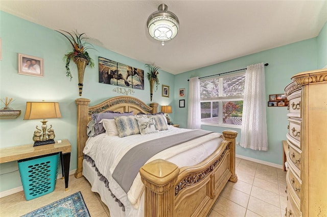 4211 30th Ln E, Bradenton, FL 34208 - bedroom featuring baseboards and light tile patterned floors