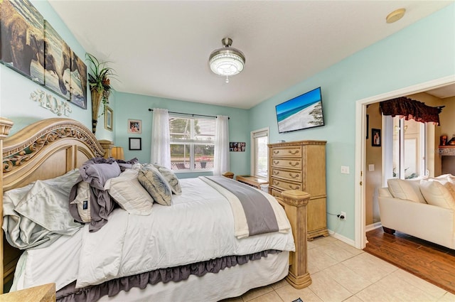 4211 30th Ln E, Bradenton, FL 34208 - bedroom with baseboards and light tile patterned flooring