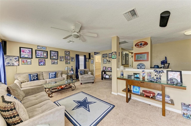 4211 30th Ln E, Bradenton, FL 34208 - carpeted living room featuring a textured ceiling, visible vents, and a ceiling fan
