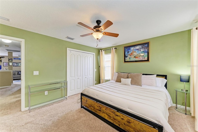 4211 30th Ln E, Bradenton, FL 34208 - carpeted bedroom with baseboards, ceiling fan, a closet, and visible vents