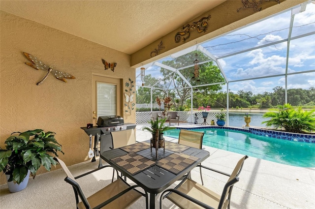 4211 30th Ln E, Bradenton, FL 34208 - view of swimming pool with a fenced in pool, a patio, grilling area, a water view, and glass enclosure