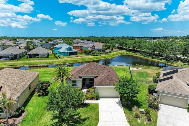aerial perspective of suburban area with a nearby body of water